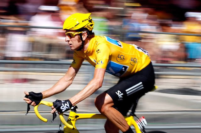 Who will be wearing the yellow jersey on the Champs Elysées on 26th July?